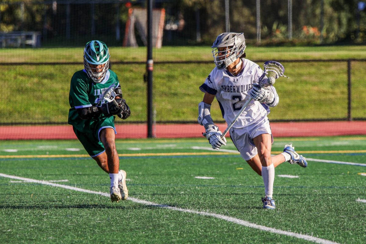 MAKING HIS MARK: Senior Jeremiah Tak weaves through the defense, scanning the field for his next move in their game against Irvine High.