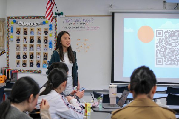SHARING EDUCATION: Senior Winnie Wei, president and founder of MORB, leads one of their weekly lunch meetings as members prepare to hear speeches from leadership candidates looking to continue the club’s mission to share educational resources. 