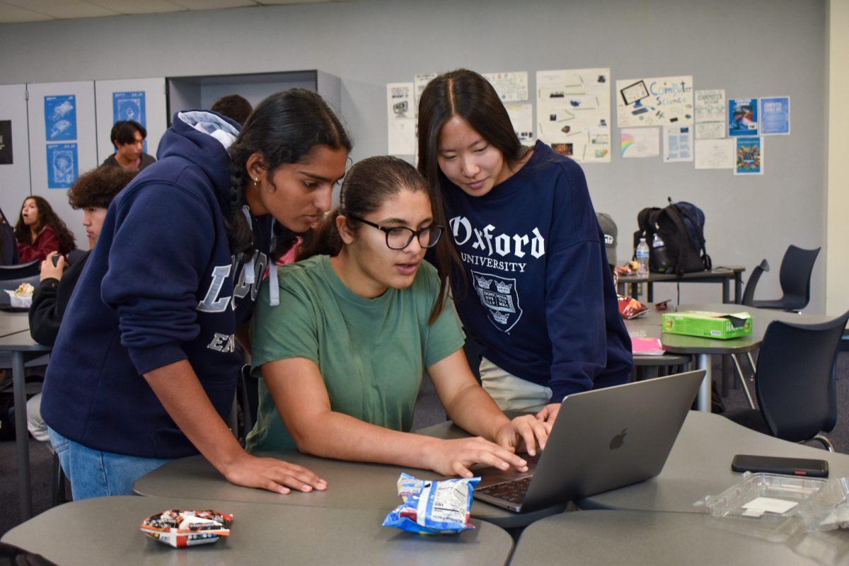 RADIANT ROBOTICS: Northwood Robotics Club President and Technodream 50881A Team Manager Jia Dave works alongside her fellow board members on their VEX robot, configuring the controller and debugging errors.