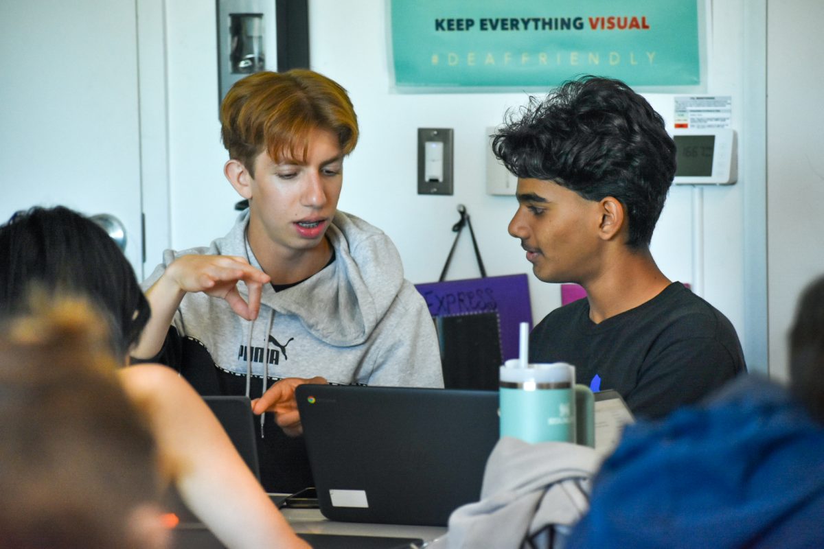 PRACTICE MAKES PERFECT: In preparation for their ASL 2 spring final, sophomores Ibrahim Afridi and Abhinav Singireddy practice signing their chosen song.
