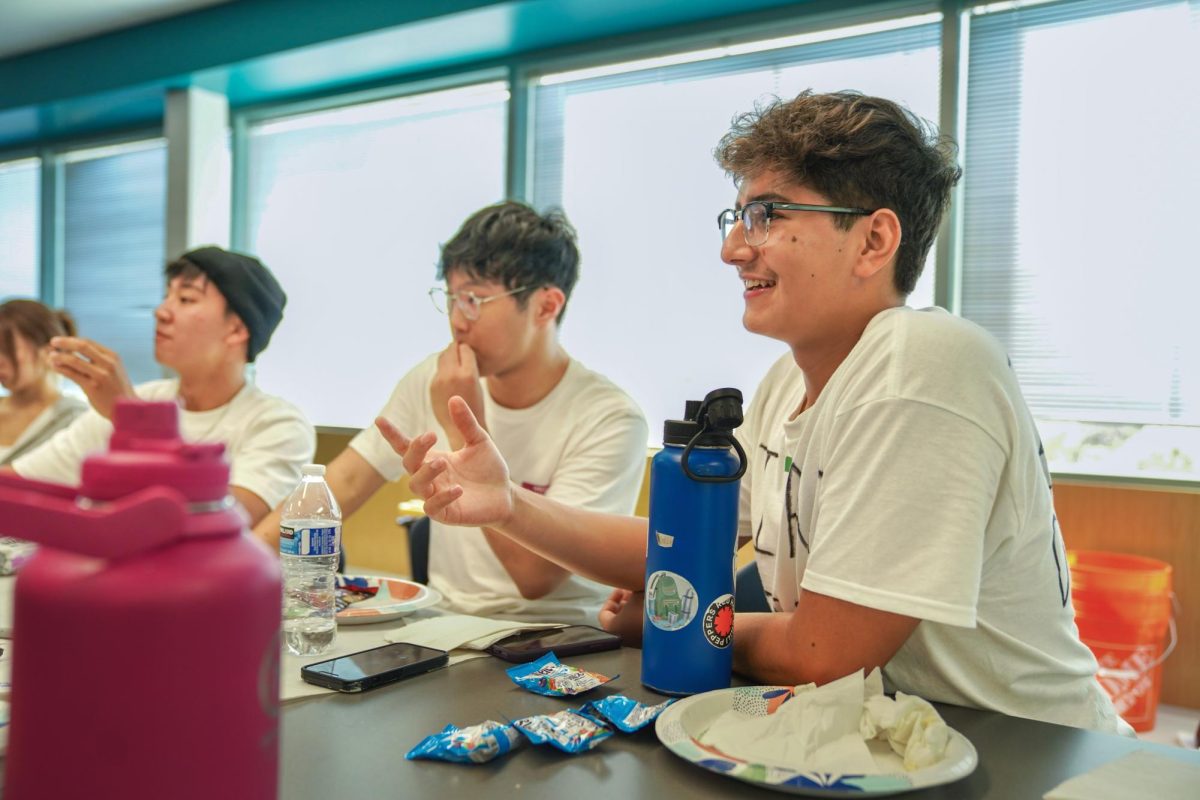 AP-SOLUTELY READY: Junior Elijah Perez enjoys snacks while chatting with his friends about their upcoming classes during AP/Honors Headstart Camp.
