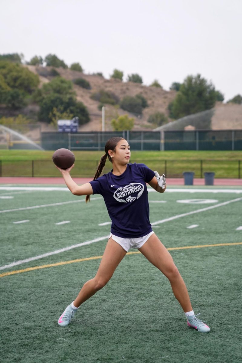 CALLING THE SHOTS: Freshman Jocelyn Lee plays quarterback during a mixed summer practice.