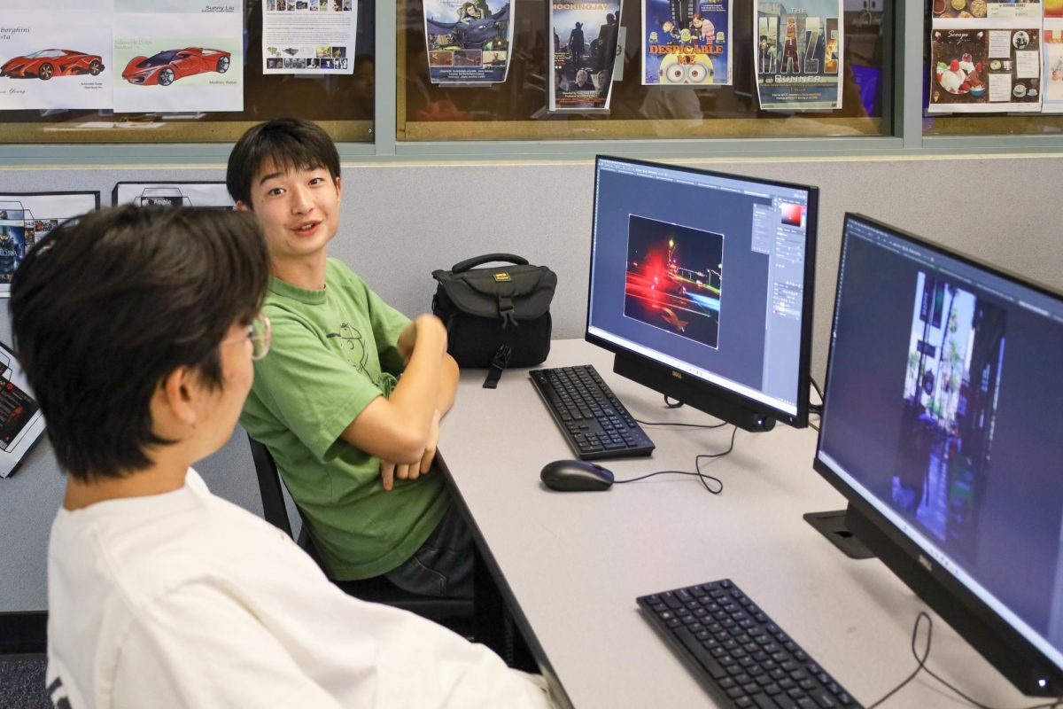 FRAMING THE PHOTO: While editing a photo assignment for AP 2D Art and Design on Adobe Photoshop, juniors Adan Liu and Sean Jung discuss cropping and lighting settings during the editing phase of their projects.