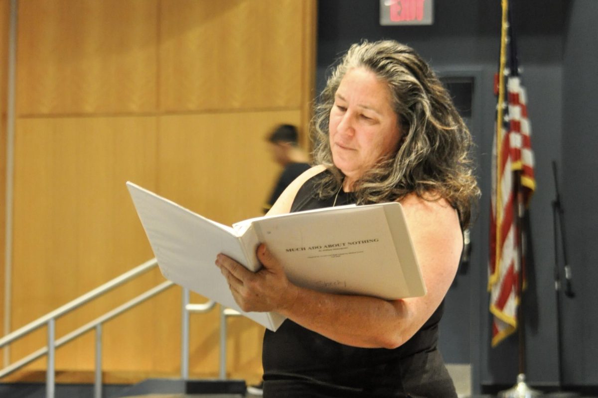 SEE, IT’S SHEEHY!: Michele Sheehy, Northwood’s new theater director, looks through the binder for the fall play, “Much Ado About Nothing,” as she directs the cast in rehearsing their lines. Despite recently stepping into the role, Sheehy has quickly adapted to Northwood’s drama program.