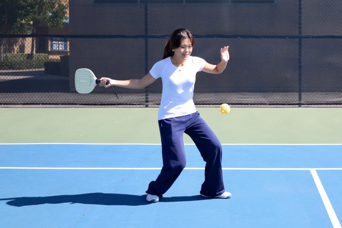 A DILL-LIGHTFUL GAME: Junior Amber Chih practices her forehand.