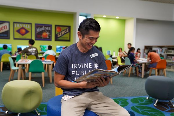 BOOKED FOR A BREAK: At Heritage Park Library, library branch supervisor David Cheung reads a book in order to unwind after a busy day. 