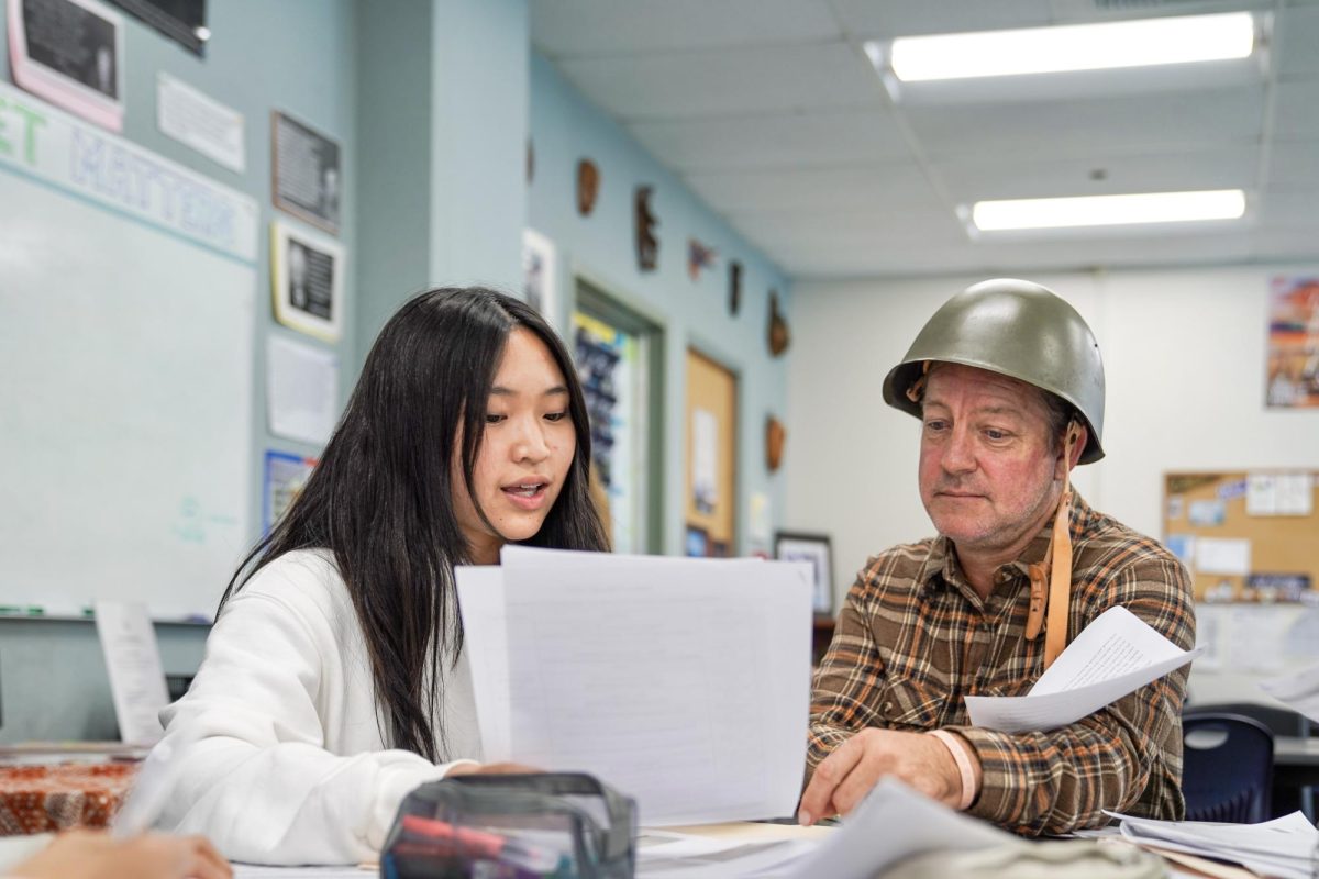 ANCHORING UNDERSTANDING: History teacher Sandy Banks guides freshman Joanna Kang through the Fall Anchor.