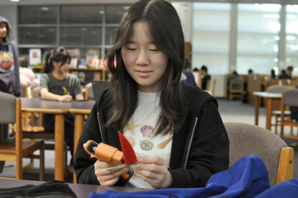 COSTUME CRAFTER: Sophomore Michelle Yoon makes her costume with hot glue and a vision. This year, her “Chainsaw Man” costume requires meticulous designing and precision to execute.
