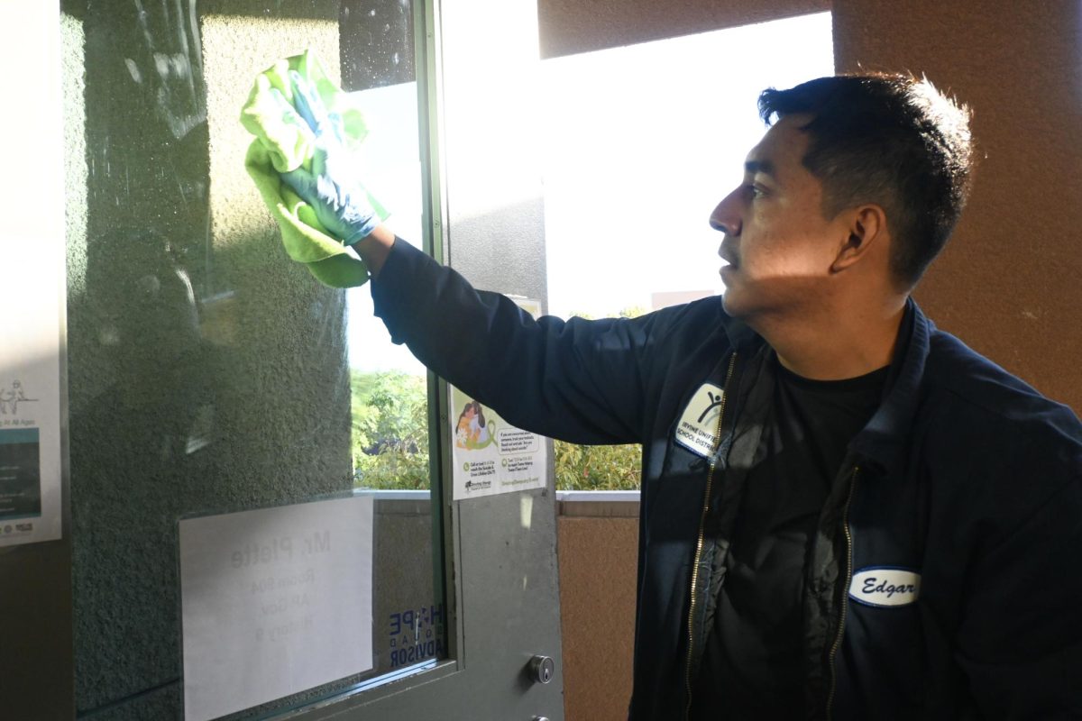 SQUEAKY CLEAN: Night custodian Edgar Flores’ eight-and-a-half-hour shift includes wiping down glass, vacuuming floors and locking up campus. 