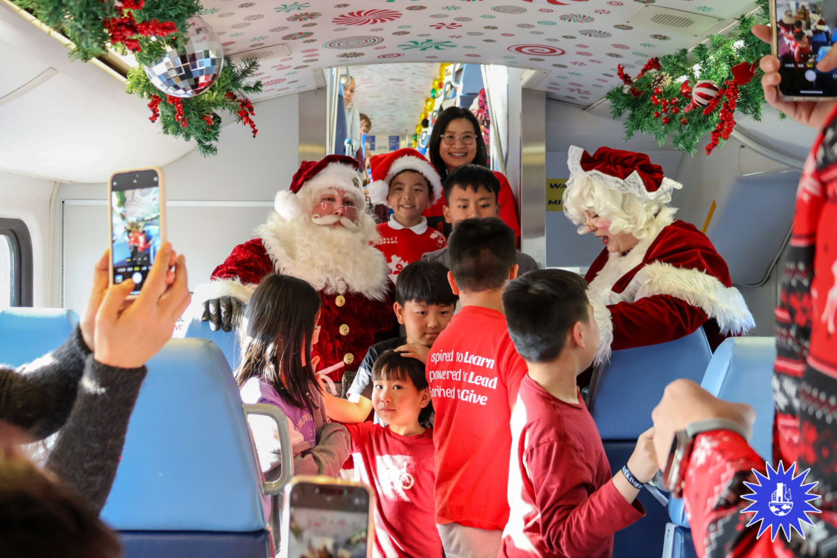 METROLINK IS COMING TO TOWN: A family poses with Santa aboard the Holiday Express on Dec. 6.