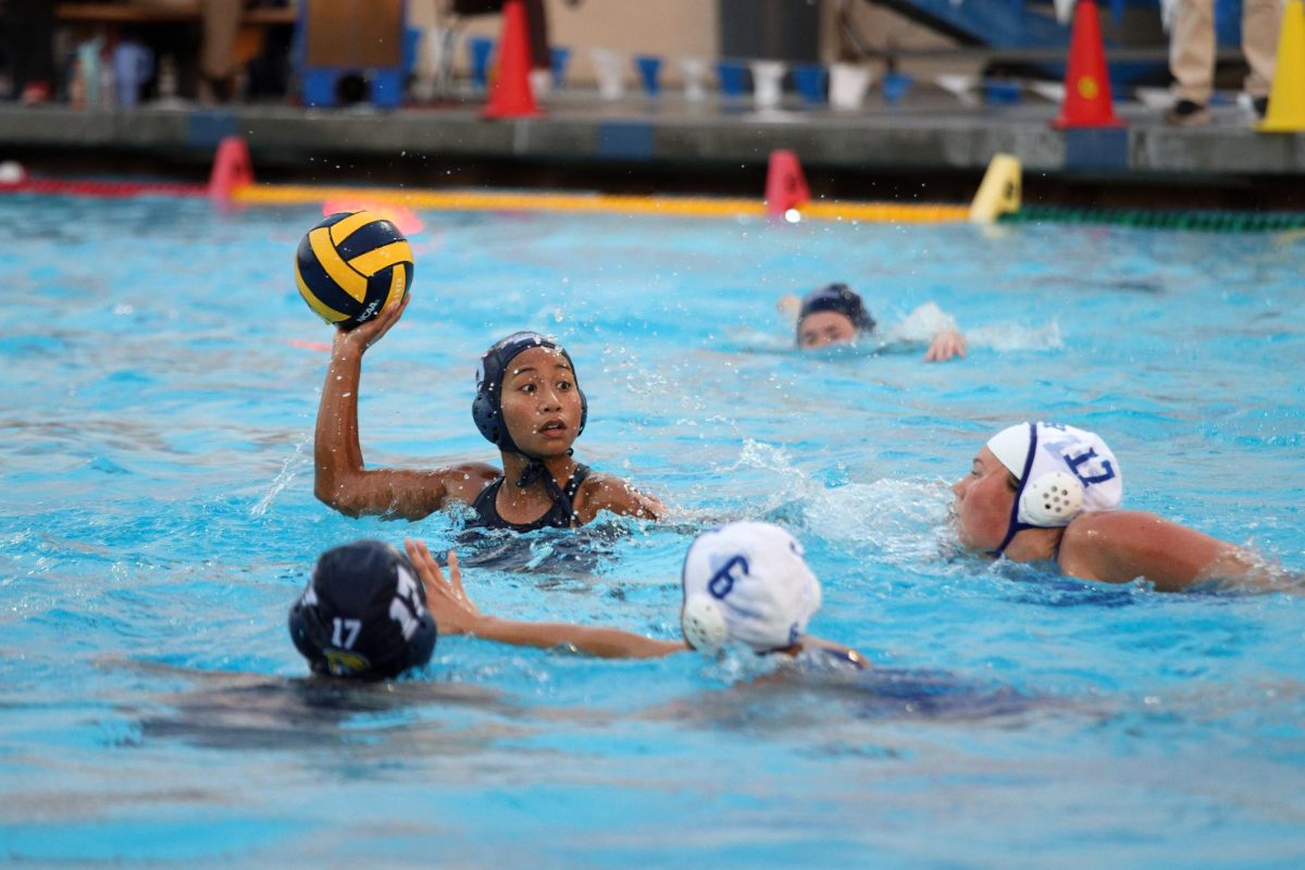 SOARING THROUGH CIF: Varsity girls water polo side attacker junior Audrey Manlapaz throws the ball during first round of CIF.