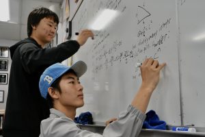 MATH MAGICIANS: Vincent Li and Jason Li practice solving geometry problems in preparation for USAMO.