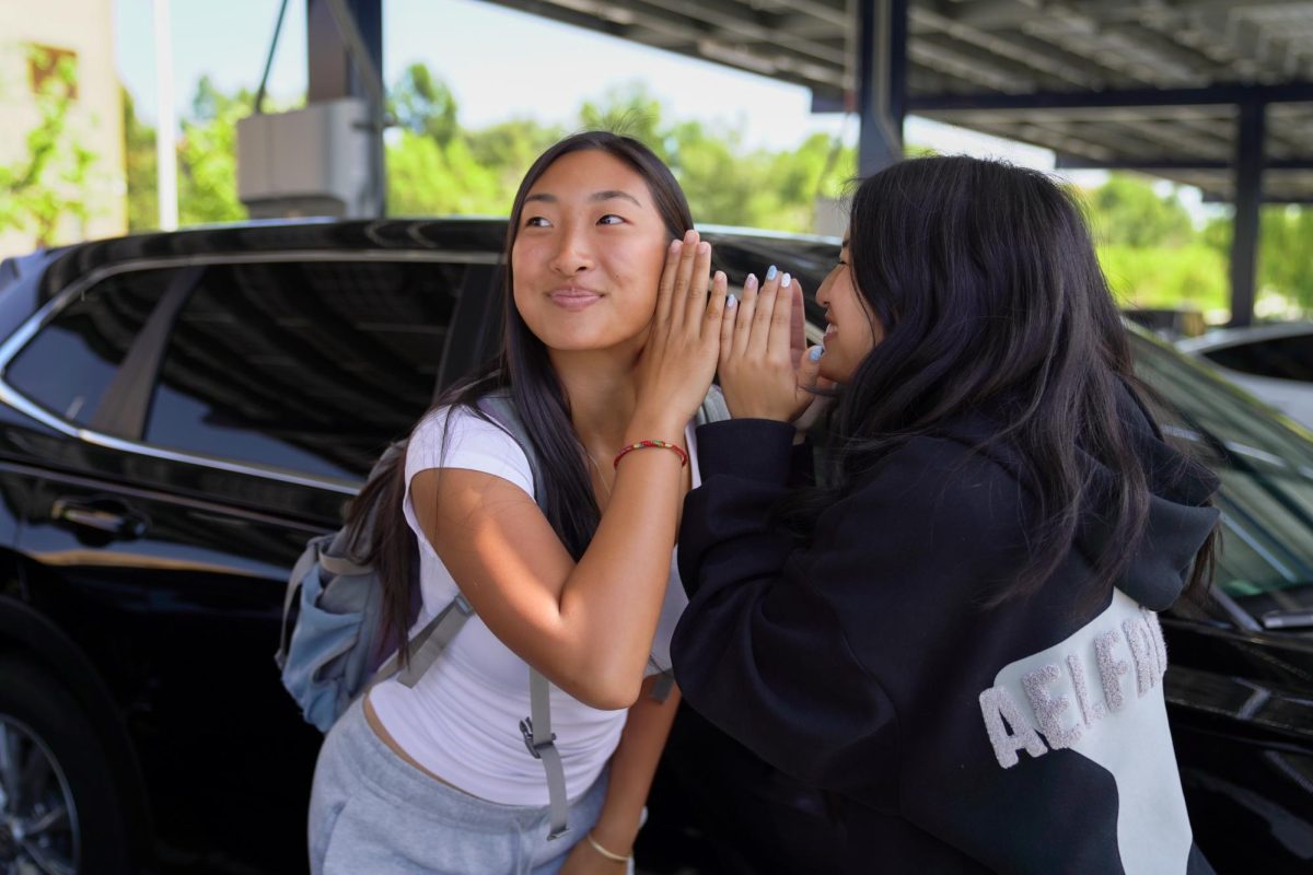 MISINFORMATION IN MOTION: Juniors Lizzy Li and Mia Chun demonstrate how easily false information can spread and be misinterpreted.